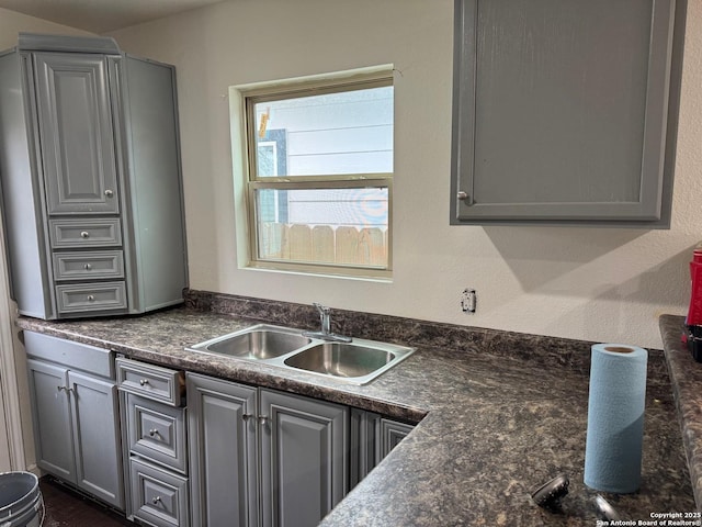 kitchen featuring gray cabinetry and sink