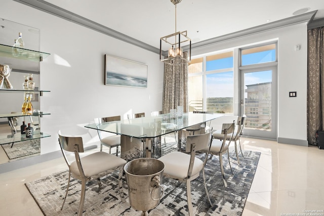 dining room featuring a chandelier, crown molding, and light tile patterned flooring