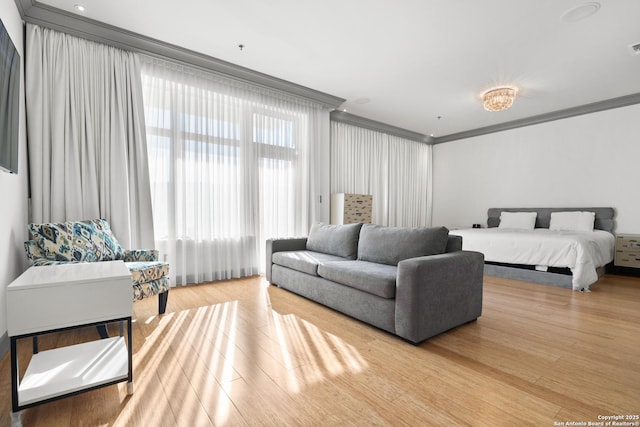 bedroom featuring wood-type flooring and ornamental molding