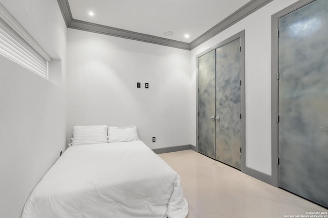 bedroom with a closet and ornamental molding