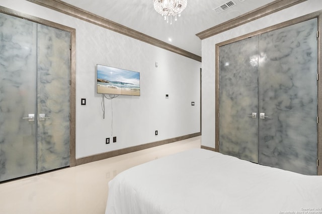 bedroom featuring an inviting chandelier and ornamental molding