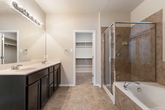 bathroom featuring tile patterned flooring, vanity, and separate shower and tub