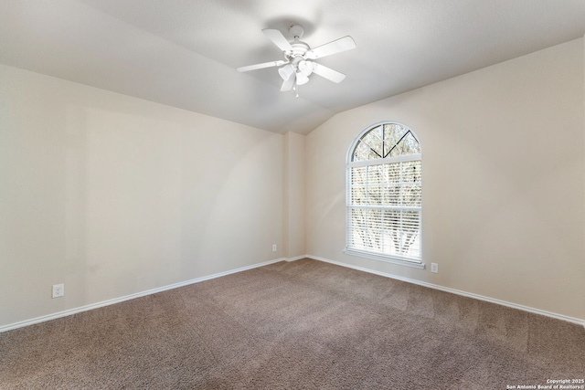 empty room featuring carpet, ceiling fan, and lofted ceiling