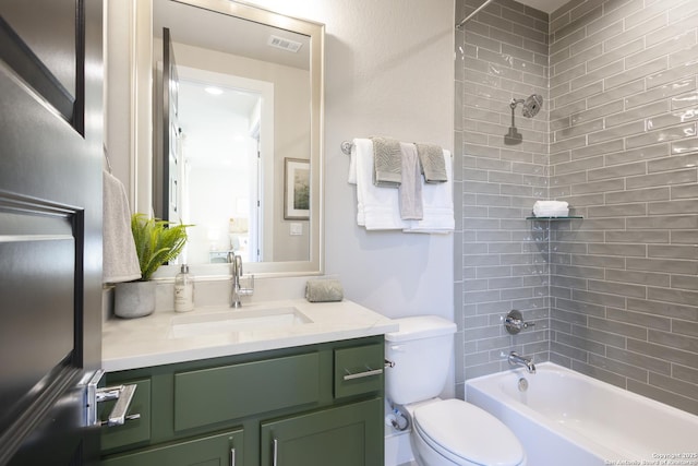 full bathroom with vanity, toilet, and tiled shower / bath combo