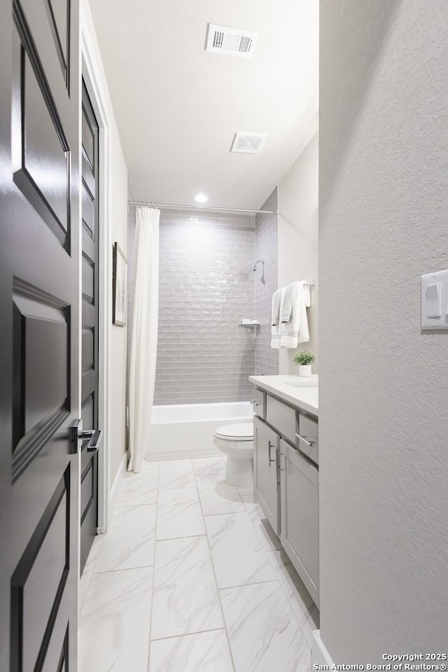 full bathroom with vanity, toilet, and shower / bath combo with shower curtain