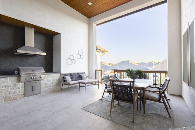 view of patio featuring an outdoor kitchen and a grill