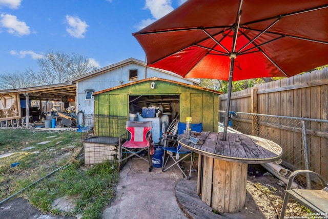 view of patio / terrace with a storage shed