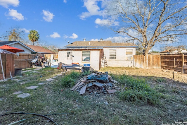 rear view of house featuring a lawn and a patio area