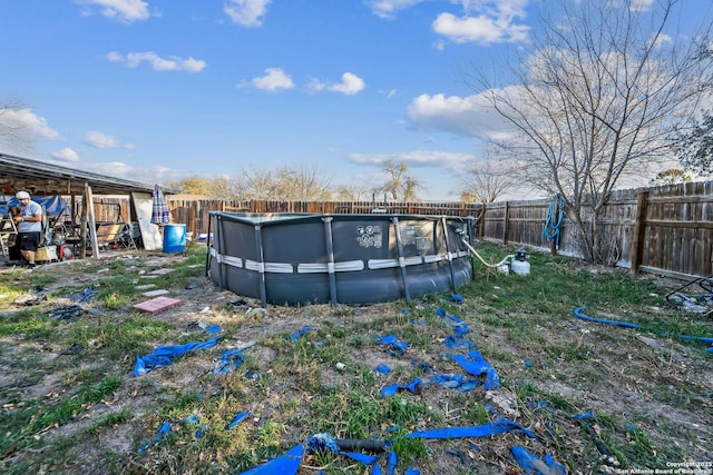 view of yard featuring a fenced in pool