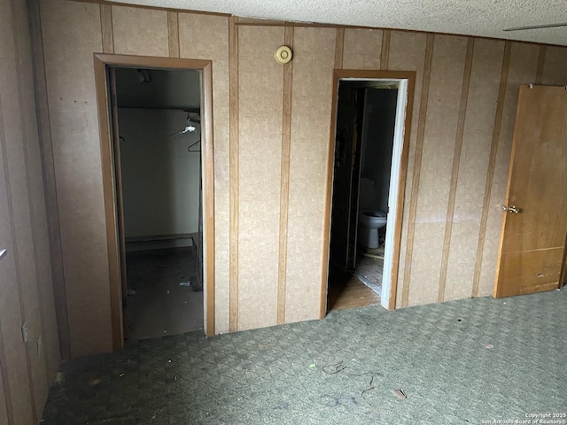 interior space with ensuite bathroom and a spacious closet