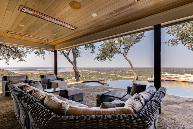 view of patio featuring a water view and an outdoor hangout area