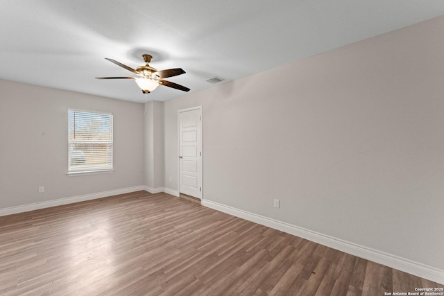 unfurnished room featuring hardwood / wood-style floors and ceiling fan