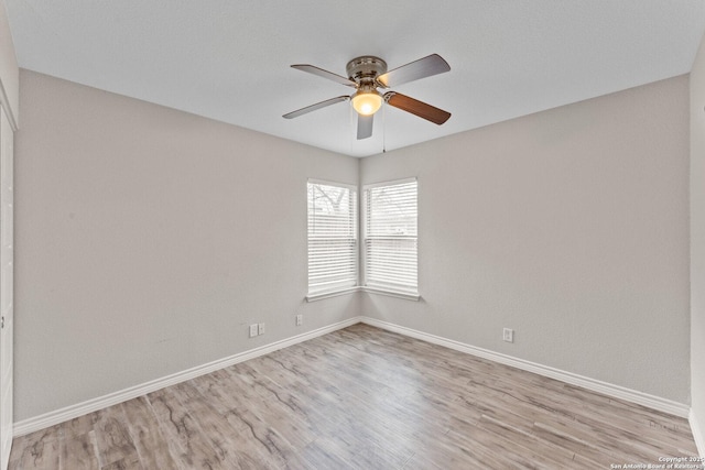 unfurnished room with light hardwood / wood-style flooring and ceiling fan