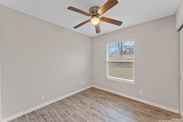 empty room with light hardwood / wood-style flooring and ceiling fan