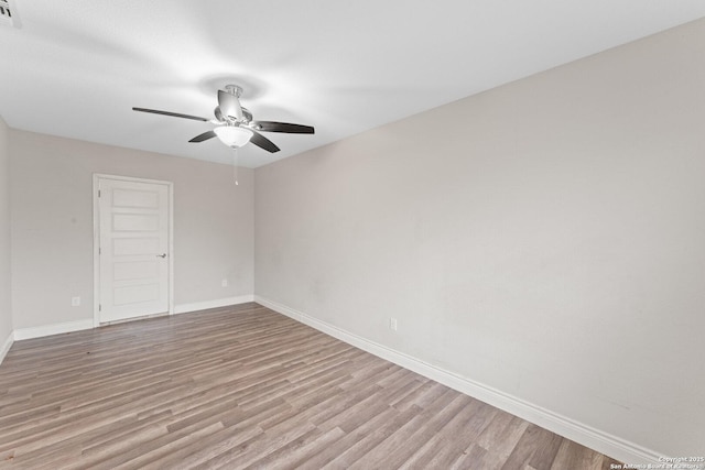 empty room featuring ceiling fan and light wood-type flooring