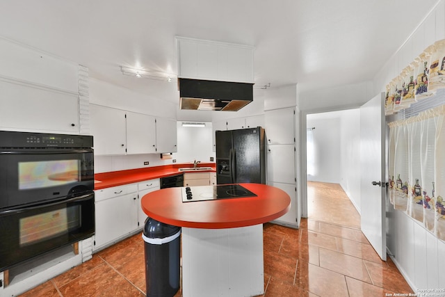 kitchen with white cabinetry, a center island, sink, light tile patterned flooring, and black appliances