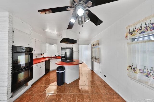 kitchen featuring ceiling fan, sink, black appliances, a center island, and white cabinetry