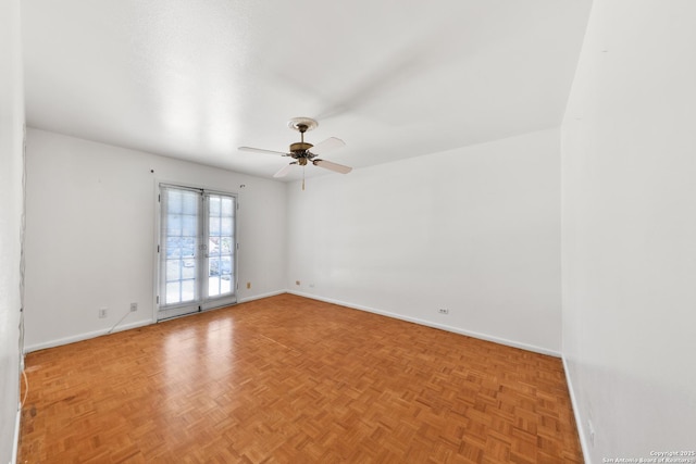 spare room featuring light parquet flooring and ceiling fan