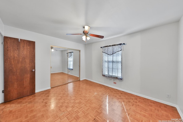 unfurnished bedroom featuring ceiling fan and light parquet floors