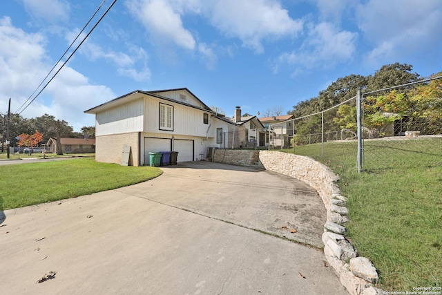 view of home's exterior featuring a yard and a garage