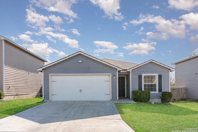 ranch-style house with a garage and a front lawn