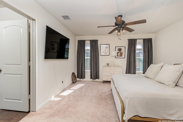 carpeted bedroom with ceiling fan