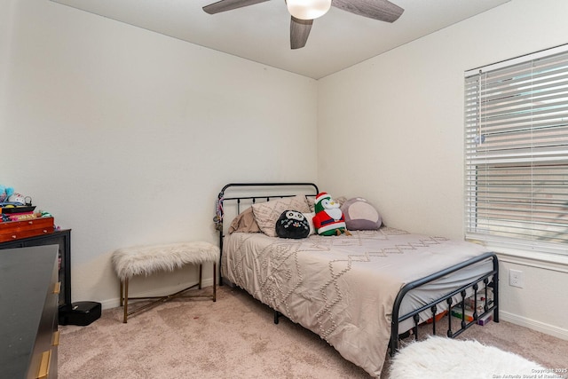 bedroom featuring ceiling fan and light carpet