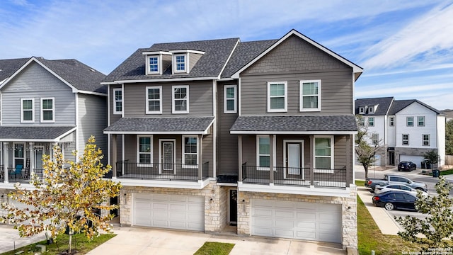 view of front of home with a balcony and a garage