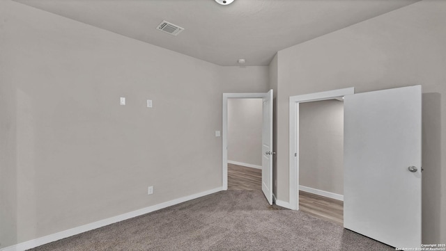 unfurnished bedroom with carpet