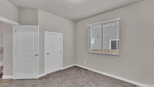 unfurnished bedroom featuring carpet floors