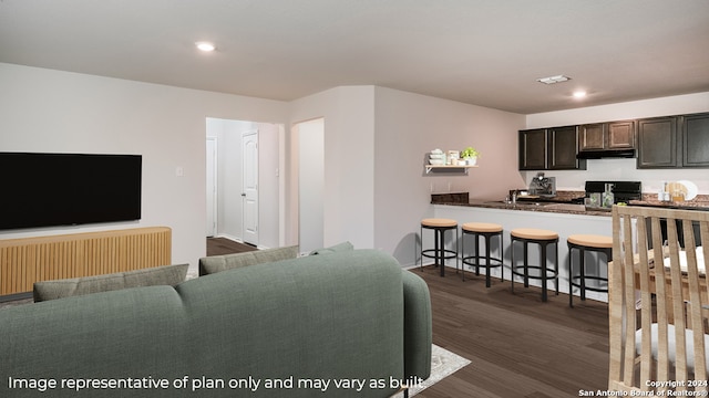 living room featuring dark hardwood / wood-style floors and sink