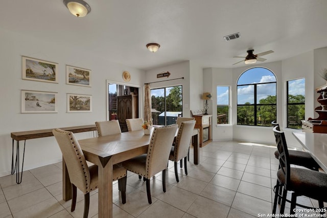 dining room featuring ceiling fan and light tile patterned floors