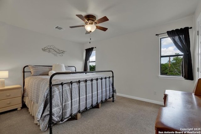 carpeted bedroom featuring ceiling fan