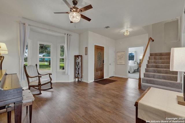 foyer with hardwood / wood-style flooring and ceiling fan