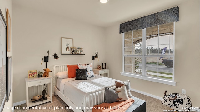 bedroom with carpet floors and multiple windows