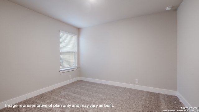 empty room featuring carpet flooring
