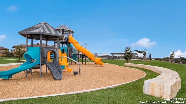 view of play area featuring a lawn