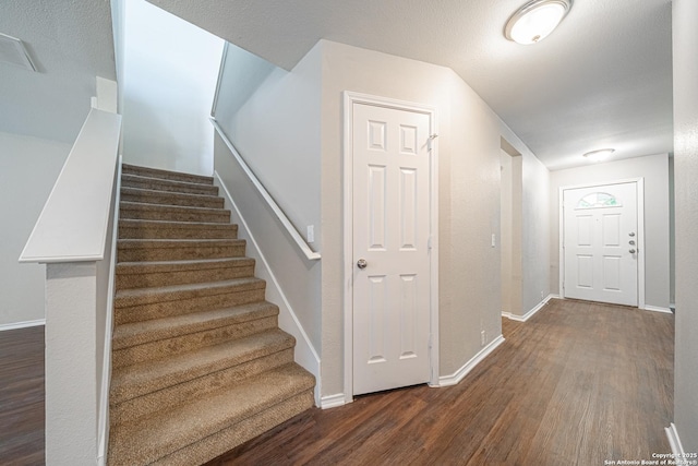 stairway with wood-type flooring