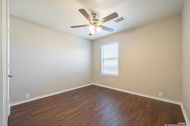 unfurnished room with ceiling fan and dark wood-type flooring