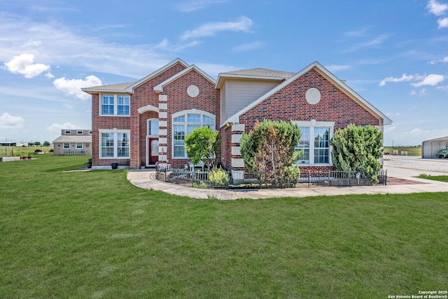 view of property featuring a front lawn