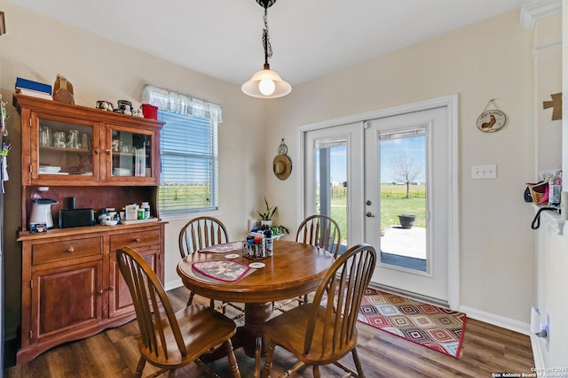 dining room with dark wood-type flooring and french doors