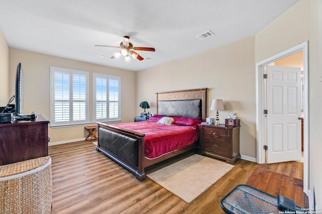 bedroom featuring ceiling fan and light hardwood / wood-style floors