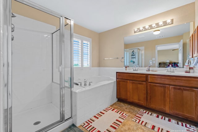 bathroom featuring tile patterned floors, vanity, and independent shower and bath