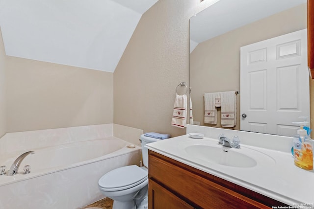 bathroom featuring vanity, a bathtub, toilet, and lofted ceiling