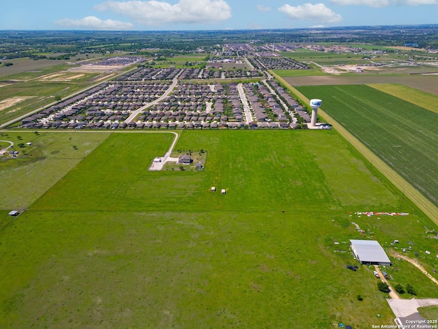 birds eye view of property with a rural view