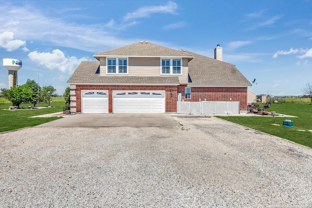 view of front of home featuring a garage and a front lawn