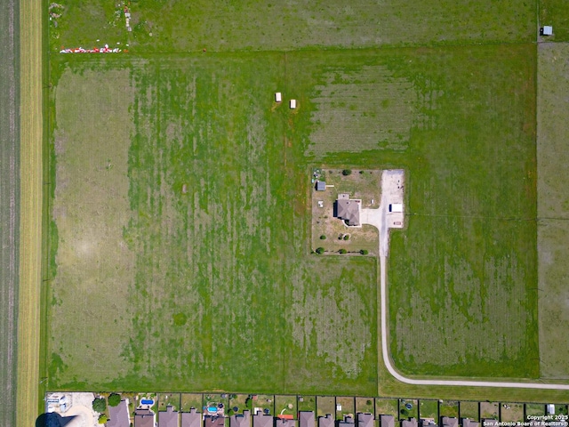 birds eye view of property featuring a rural view