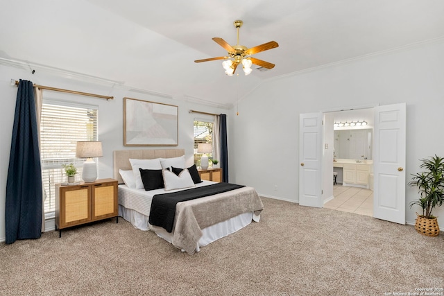 bedroom with ceiling fan, ensuite bathroom, lofted ceiling, light carpet, and ornamental molding