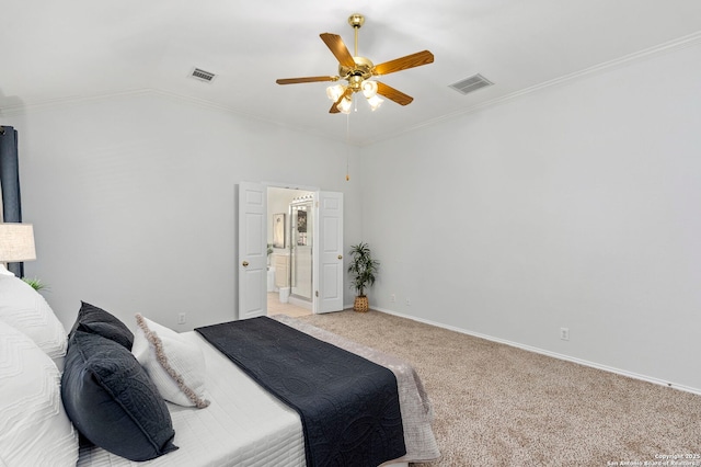 bedroom featuring ceiling fan, ensuite bathroom, light colored carpet, and ornamental molding