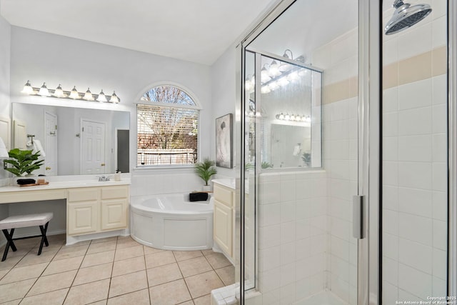 bathroom featuring tile patterned flooring, vanity, and separate shower and tub